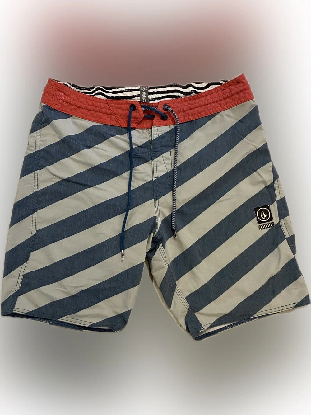 Volcom stoneys board shorts, size 30, color red and blue